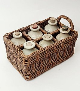 Stoneware Bottles In Basket