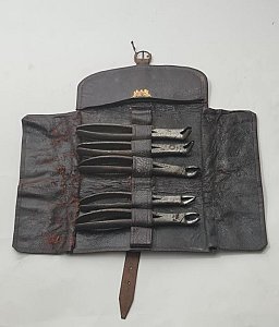 Aged Leather Dentist Wrap With Dental Pliers