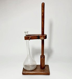 Glass Flask in Wooden Retort
