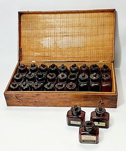 Wooden Box Of Brown Bottles
