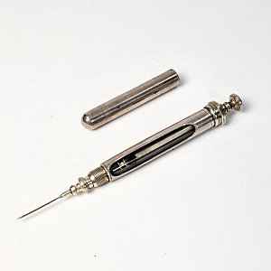 Silver Syringe With Integral Case