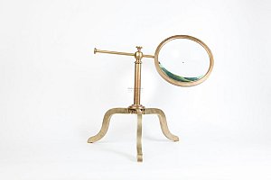 Magnifying lens on brass stand