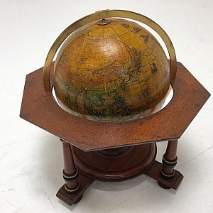 Tabletop globe on stand.