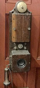 Wall-mounted, vintage telephone