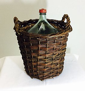 Glass flagon in basket