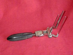 19th century triblade vaginal speculum