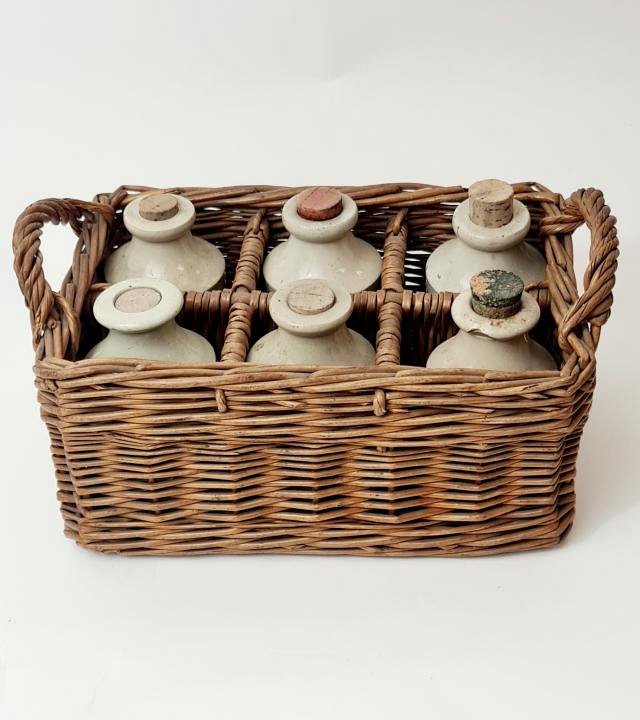 Stoneware Bottles In Basket