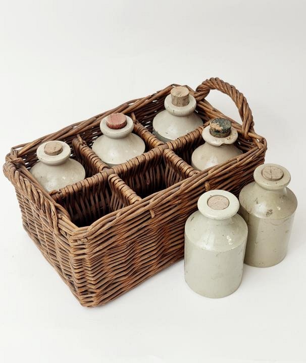 Stoneware Bottles In Basket