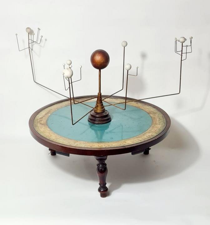 Orrery model on decorative base.