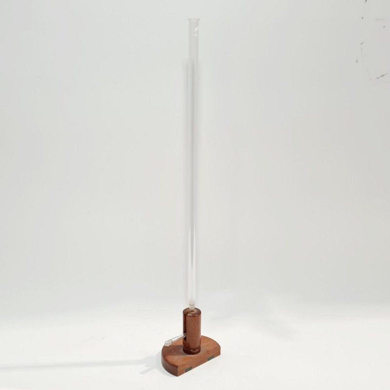 Glass Column On Wooden Base