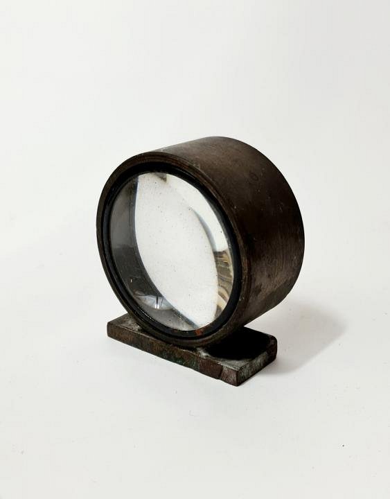 Lens In Bronze Stand