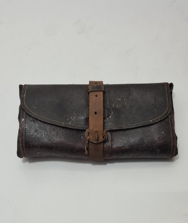 Aged Leather Dentist Wrap With Dental Pliers