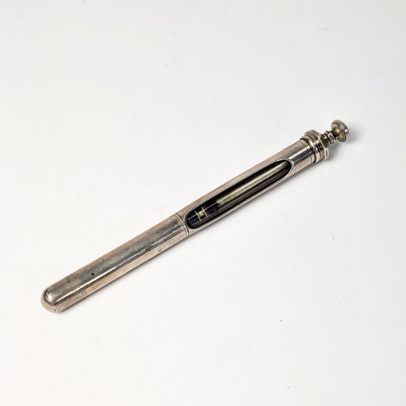 Silver Syringe With Integral Case