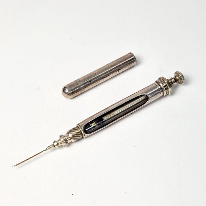Silver Syringe With Integral Case