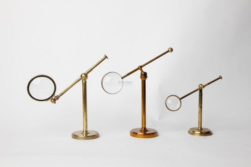 Magnifying glasses on brass stands