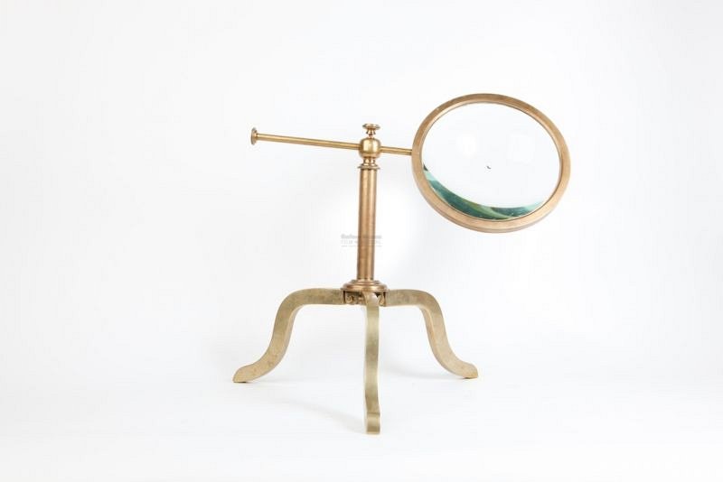 Magnifying lens on brass stand