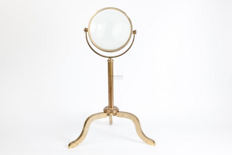 Magnifying lens on brass stand