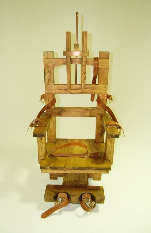 Wooden electric chair with leather restraining straps