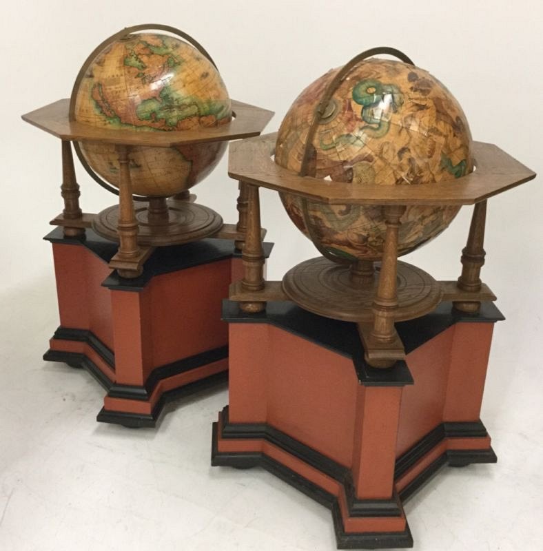 Pair of large globes on stands.