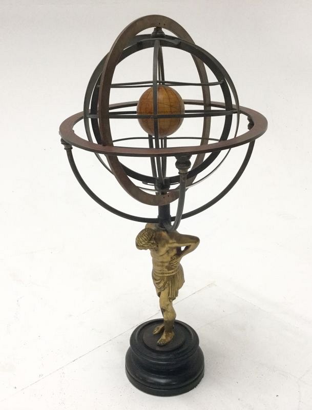 Armillary sphere on decorative stand.