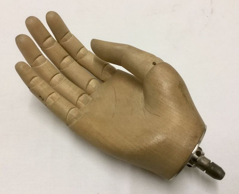 Wooden prosthetic hand with rigid fingers