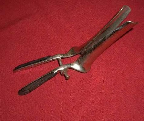 Twin bladed speculum